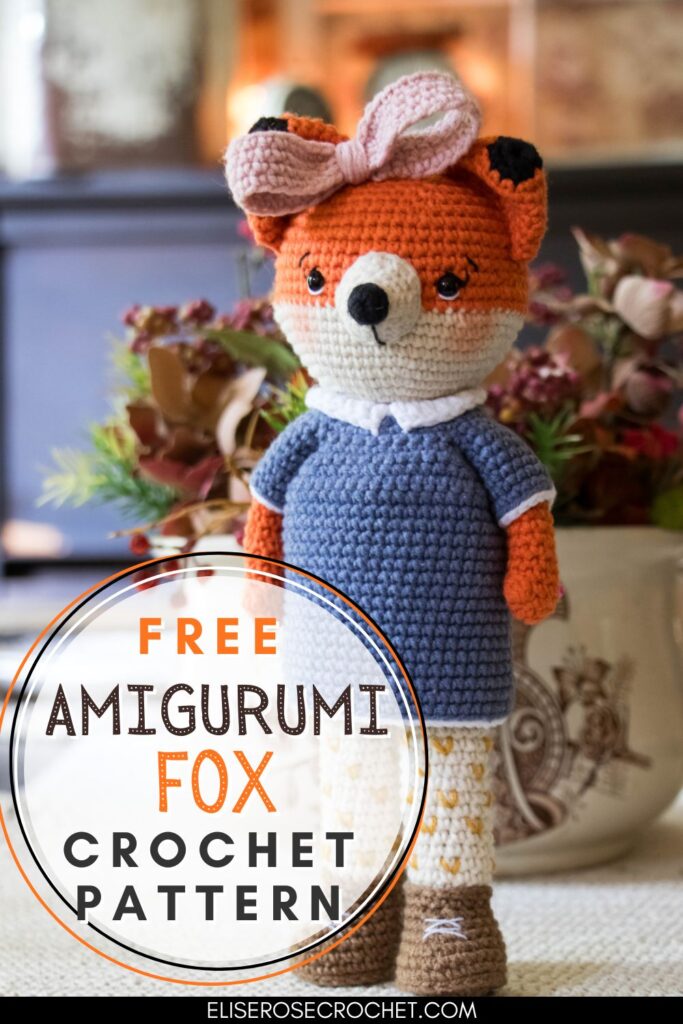 amigurumi crochet fox in a blue dress